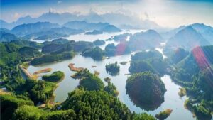 a aerial view of a river surrounded by trees