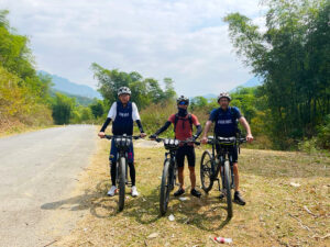 a group of people on bicycles on a road