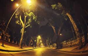 a street with and street lights at night in Hoang Dieu Street